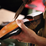 Munno Para Shoe Repairs Banner image where it depicts craftsmanship of shoe repairs